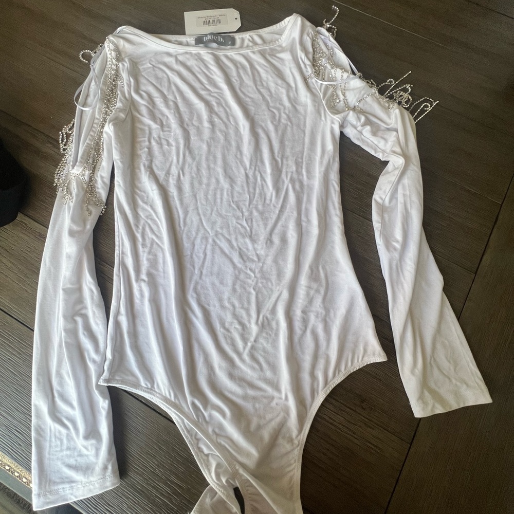 Boutique body suit with jewels on the side